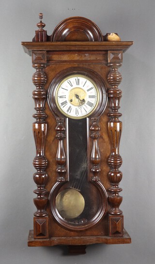 A Vienna style regulator wall clock contained in a walnut case 91cm h x 47cm w x 18cm d, (finial missing, pediment is broken, incorrect pendulum with clock, split to front of case above dial)