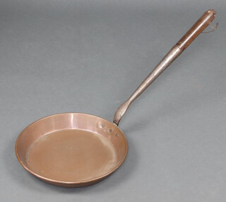 A copper saucepan with turned wooden handle 34cm (signs of old but treated worm to handle)