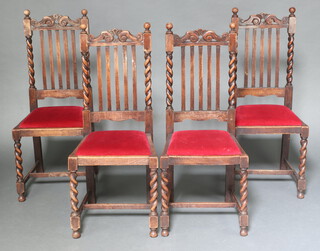 A set of 4 1930's oak stick and rail back dining chairs with upholstered drop in seats on spiral turned supports with H framed stretcher 108cm h 