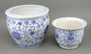 A Chinese style blue and white fish bowl 30cm x 36cm together with a blue and white jardiniere 20cm x 28cm 