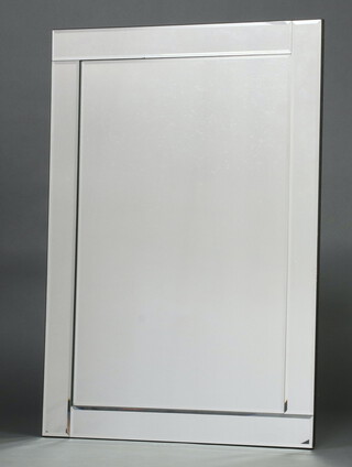 A rectangular frameless bevelled plate mirror 109cm x 77cm 