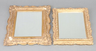 A 19th Century rectangular plate mirror contained in a decorative gilt frame 30cm x 26cm and 1 other 26cm x 22cm (some gilding loss to frames) 