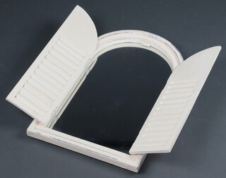 An arched plate mirror contained in a white painted shuttered frame 58cm x 38cm 