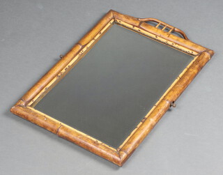 A rectangular plate mirror contained in a bamboo frame 56cm x 36cm 