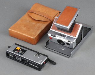 A Canon 110ED camera together with a Polaroid camera and case