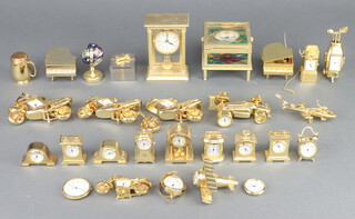 A collection of miniature brass time pieces 