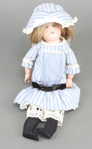 An Armand Marseille bisque headed doll with glass eyes and visible teeth 34cm 