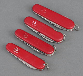 Four Victorinox pocket knives 