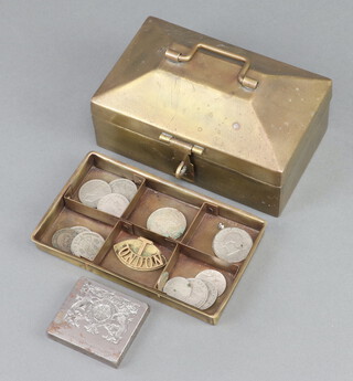 A brass cash tin together with an engraved paper stamp "Appointment to HM The Queen" and minor coins 