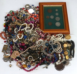 A quantity of costume jewellery and coins 