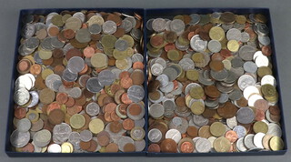 Two trays of world coins 