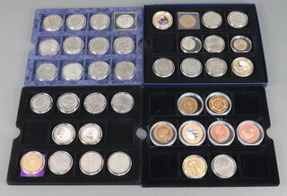 Four trays of commemorative coins 