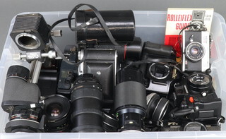 A Ricoh 500ME camera and a quantity of cameras and lenses 