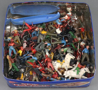 A collection of lead cowboy and other figures, canoes, etc