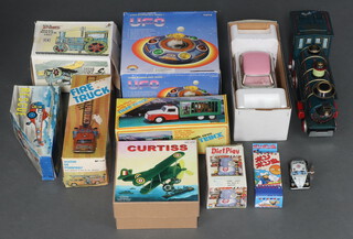 A collection of 1970's and 80's mainly Chinese tin plate toys to include Photoing in Car, Deluxe Sedan, Jumping Zebra, etc 