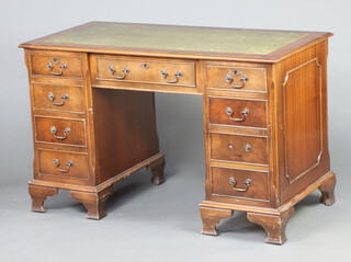 A mahogany desk with inset green writing surface above 1 long and 8 short drawers, raised on ogee bracket feet 76cm h x 121cm w x 61cm d (in 1 section, contact marks in places)