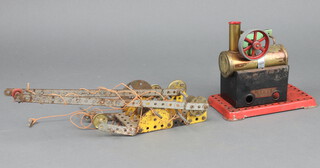 A Mamod stationary steam engine 15cm x 16cm x 9cm (missing pressure valve to the top) together with a Meccano crane