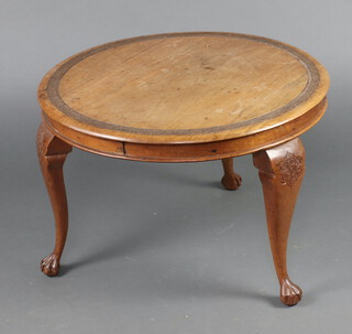 A circular carved Burmese hardwood coffee table raised on cabriole supports 45cm h x 68cm diam. (water, ring and contact marks in places) 