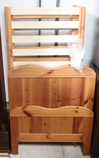 A pine framed cot 90cm h 