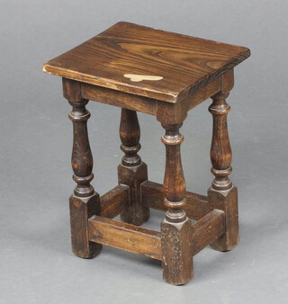 A rectangular oak joined stool raised on turned and block supports 40cm h x 29cm w x 25cm d (water and contact marks)