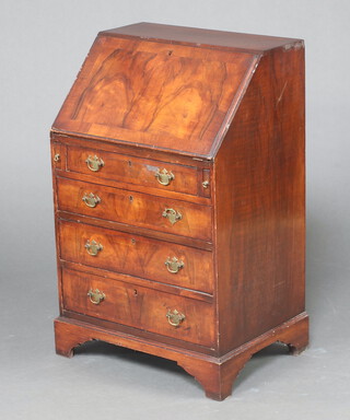 A Queen Anne style walnut bureau with fall front above 3 long graduated drawers, on bracket feet, 92cm h x 59cm w x 43cm d (veneers and escutcheon missing) 