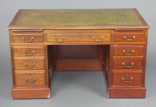 An Edwardian mahogany kneehole pedestal desk with green inset leather writing surface, fitted 1 long drawer, 2 brushing slides and 8 short drawers 75cm h x 137cm  wide x 76cm d 