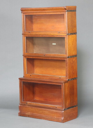A Globe Wernicke oak 4 tier bookcase 167cm h x 87cm w x 36cm d  