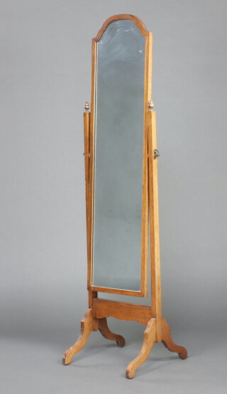 A 1930's Queen Anne style arched plate cheval mirror contained in a walnut swing frame 157cm h x 42cm w x 40cm d 