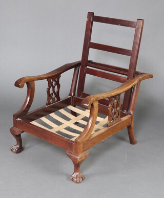 An Edwardian mahogany framed folding armchair with pierced vase shaped slats to the side, raised on cabriole supports 95cm h x 64cm w x 69cm d 