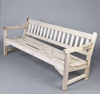 A teak slatted bench formed from timber from TSS Mooltan  78cm h x 180cm w x 64cm d, the reverse labelled Made by Hughes Bolckow Ship Breaking Company Ltd, Blyth Northumberland from teak from TSS Mooltan 