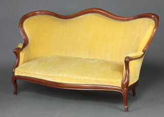 A Victorian mahogany show frame sofa upholstered in gold material, raised on cabriole supports 99cm h x 180cm w x 70cm d (seat 116cm x 36cm) 