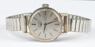 A lady's vintage Longines steel cased wrist watch the 20mm case numbered 17 964773 on a steel bracelet