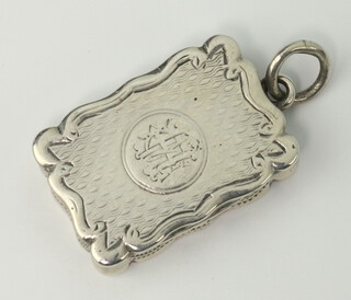 A Victorian silver engine turned rectangular vinaigrette with floral grill Birmingham 1876, 3cm 