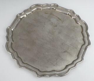 A silver salver with pie crust rim and engraved inscription, London 1927, maker Hamilton & Co Ltd 1126 grams, 34cm 