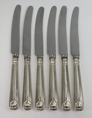 A set of 6 Victorian silver handled shell and thread dinner knives, rubbed marks 