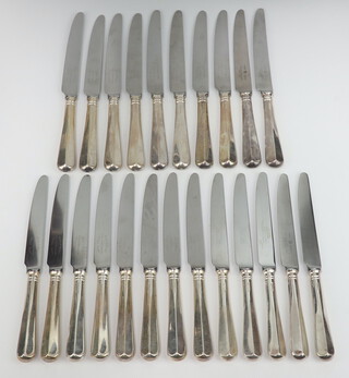 Ten silver handled rat tail dinner knives, Sheffield 1993 and 13 ditto dessert knives, Sheffield 1992 