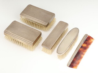 A silver engine turned brush set, 1 other clothes brush and comb 