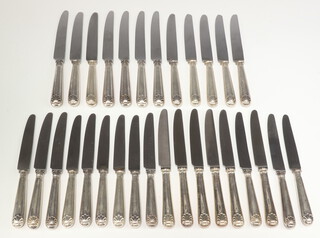 Twelve silver handled shell pattern dinner knives and 18 ditto dessert knives, Sheffield 1968