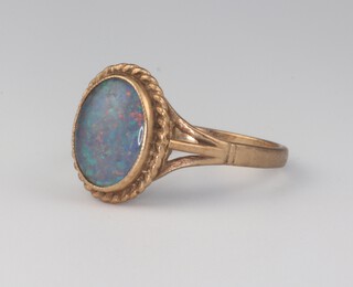 A 9ct yellow gold oval black opal ring, 2.2 grams, size N 1/2