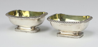 A pair of George III rounded rectangular silver egg and dart condiments with gilt interiors, London 1808, maker Rebecca Emes & Edward Barnard 1, 9cm 145 grams 