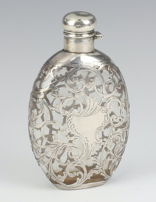 A Continental glass hip flask with silver overlay decoration 15cm 