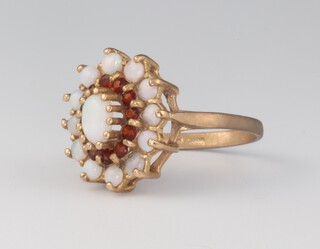 A 9ct yellow gold opal and garnet ring, 2.8 grams, size L 1/2