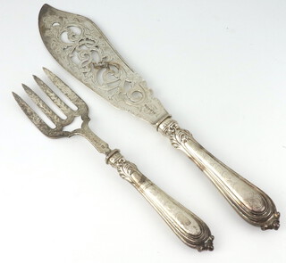 A pair of Victorian silver fish servers with pierced and engraved decoration Birmingham 1855 maker Joseph Gloster