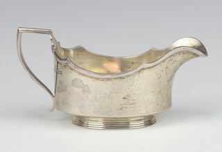 An Art Deco silver sauce boat with ribbed base Sheffield 1937, 174 grams 