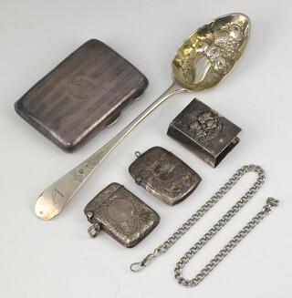 A silver engine turned cigarette case Birmingham 1921, a berry spoon, 2 vestas, a match box holder, 148 grams 