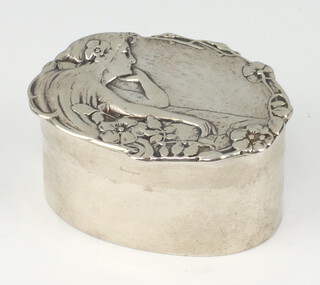 An Art Nouveau repousse silver pill box decorated with a lady, Chester 1900, maker William Neale 6cm, 40 grams 