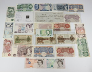 A mauve 10 shilling note, Chief Cashier K O (Kenneth) Peppiatt N63D413600, 2 George V one pound notes, 7 ten shilling notes, 11 one pound notes, 5 five pound notes, 3 ten pound notes and a twenty pound note