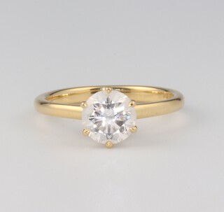 An 18ct yellow gold single stone brilliant cut diamond ring, approx. 1ct, size I  together with a GIA certificate, stating  colour E, clarity SI1, 2.4 grams 