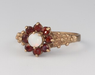 A 9ct yellow gold opal and garnet ring 1.8 grams, size L 1/2