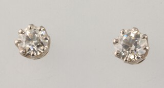 A pair of yellow metal single stone brilliant cut diamond ear studs, each approx. 0.5ct, colour J/K, clarity SI2 